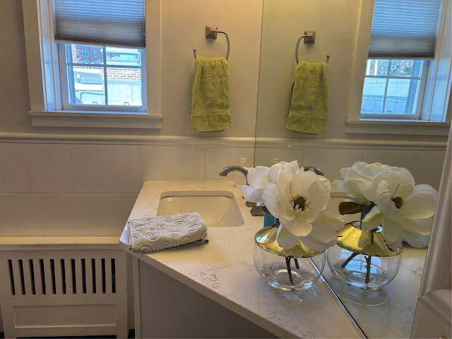 bathroom with plenty of natural light and vanity