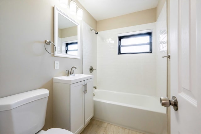 full bathroom with  shower combination, vanity, and toilet