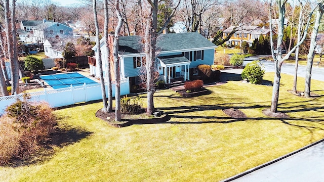 view of yard featuring fence and a residential view