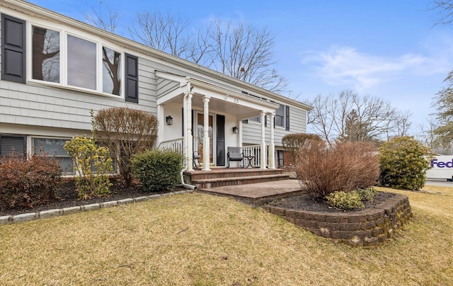 exterior space featuring a front yard and covered porch