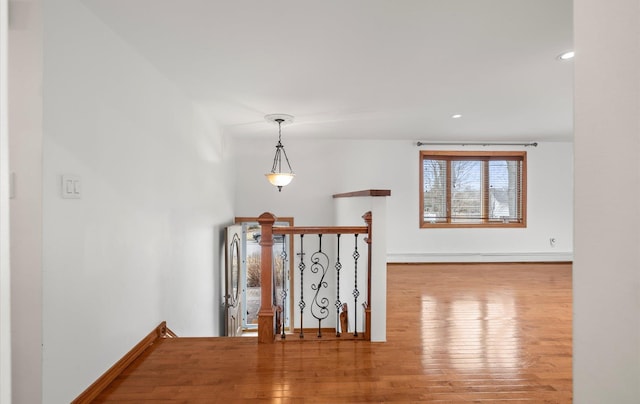 23 Franko Ln, Setauket, NY 11733 - corridor featuring an upstairs landing, wood finished floors, recessed lighting, and baseboard heating