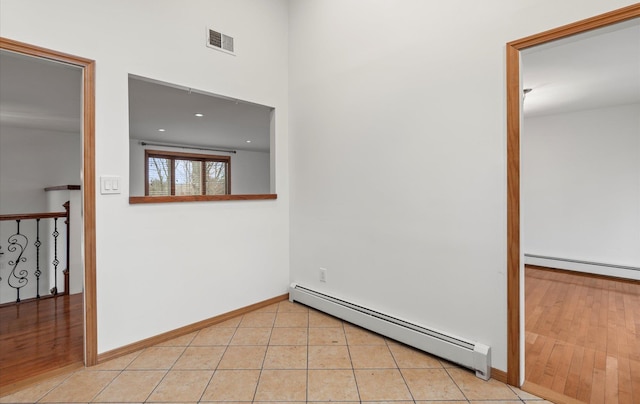 23 Franko Ln, Setauket, NY 11733 - unfurnished room with a baseboard heating unit