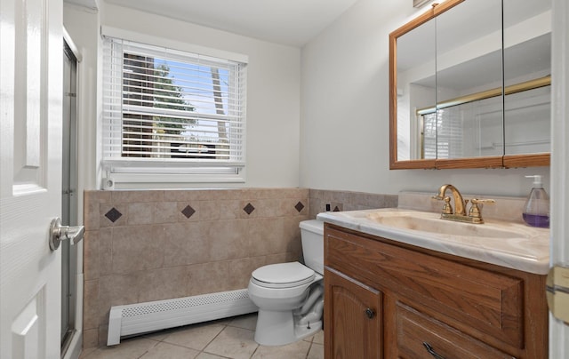 23 Franko Ln, Setauket, NY 11733 - full bath with a baseboard heating unit, tile walls, tile patterned flooring, vanity, and a wainscoted wall