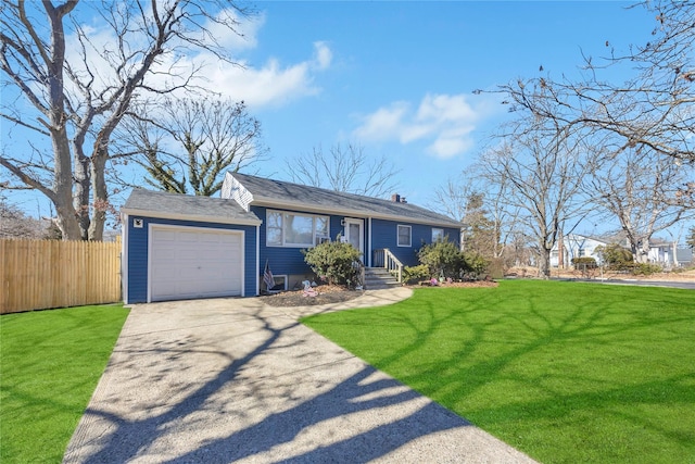 ranch-style house featuring a front yard, concrete driveway, fence, and an attached garage