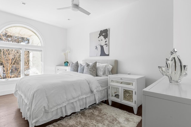 bedroom featuring a ceiling fan and wood finished floors