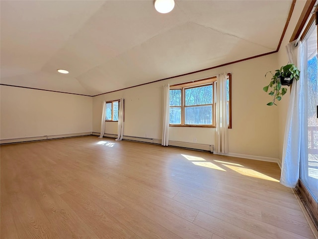 spare room with light wood-style floors, crown molding, vaulted ceiling, and a wealth of natural light