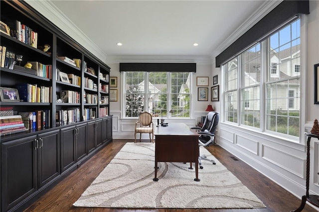 office space featuring dark wood-style floors, ornamental molding, and a wainscoted wall