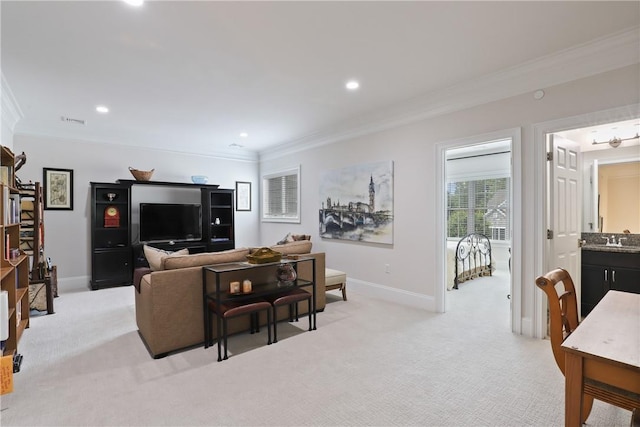 living area featuring light colored carpet, crown molding, and baseboards