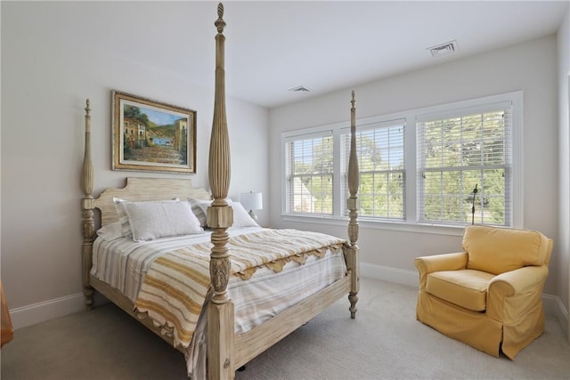 bedroom with carpet floors, baseboards, and visible vents