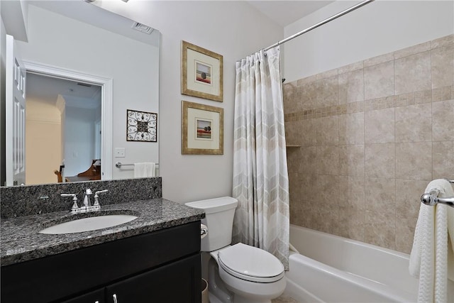 bathroom with shower / bath combination with curtain, visible vents, vanity, and toilet