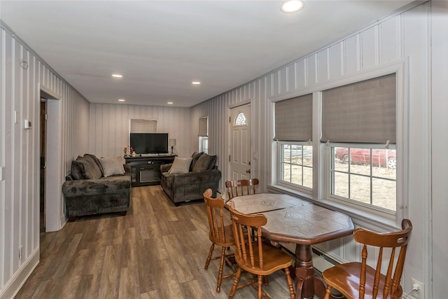 dining space with recessed lighting and wood finished floors