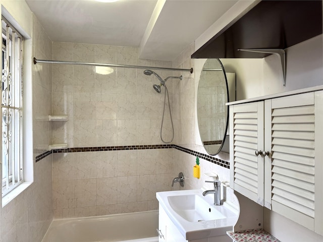 bathroom featuring shower / bath combination and vanity