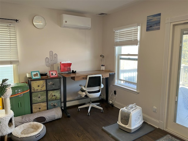 office area featuring a wall unit AC, dark wood-style floors, visible vents, and baseboard heating