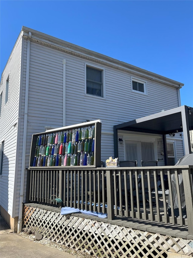 back of house featuring a deck