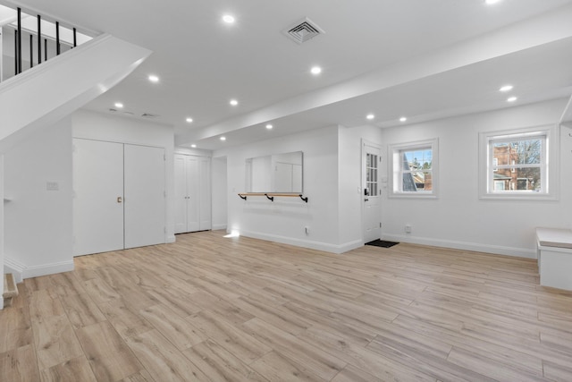 interior space featuring light wood-style floors, baseboards, visible vents, and recessed lighting