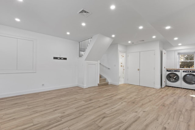 interior space featuring visible vents, independent washer and dryer, stairs, light wood-style floors, and recessed lighting