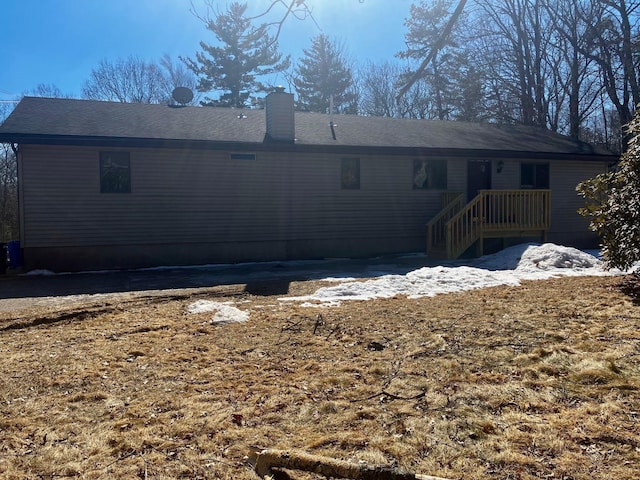 back of property featuring a chimney