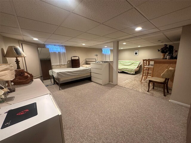 bedroom featuring recessed lighting, light colored carpet, and a paneled ceiling