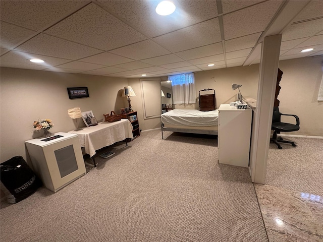 bedroom featuring a drop ceiling, carpet flooring, and recessed lighting