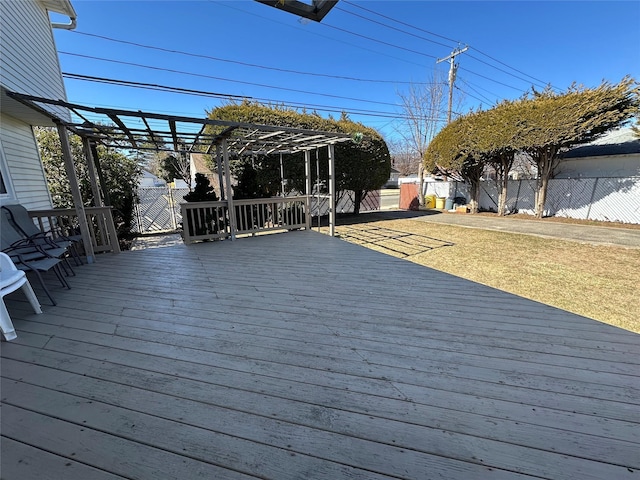 deck featuring a yard, fence, and a pergola