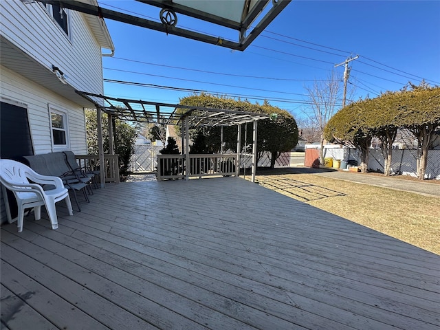 deck featuring fence and a pergola