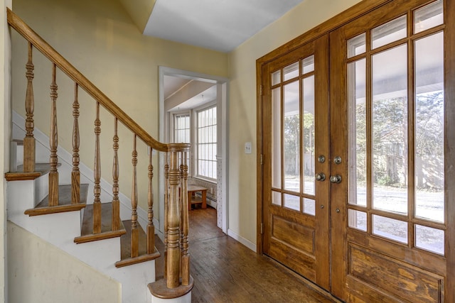 entryway featuring wood finished floors, stairway, french doors, and baseboards