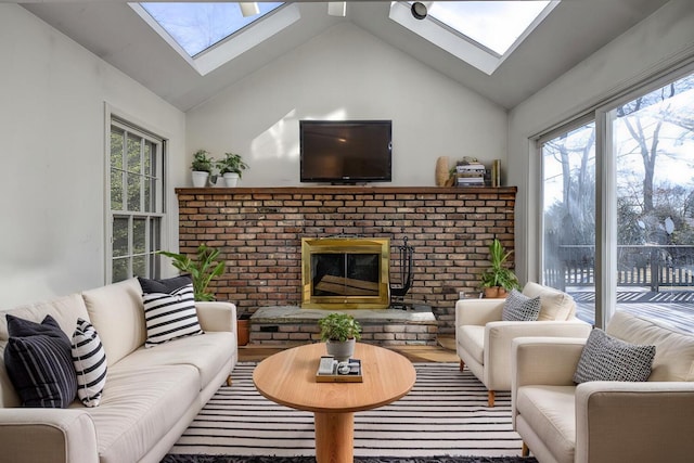 living room with a skylight, high vaulted ceiling, and plenty of natural light