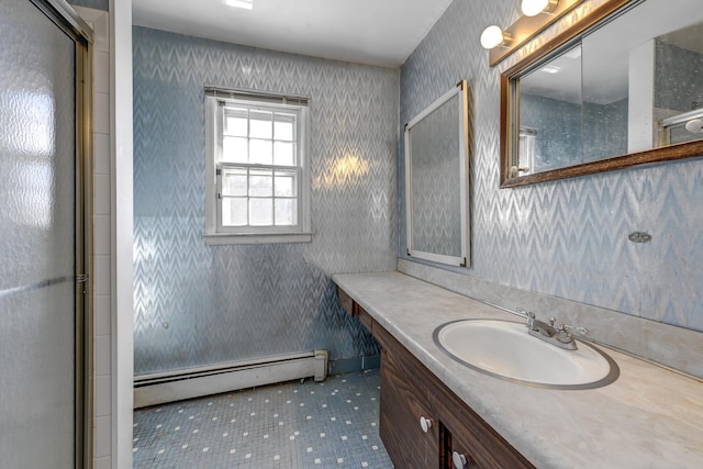 bathroom featuring a baseboard radiator, wallpapered walls, and vanity