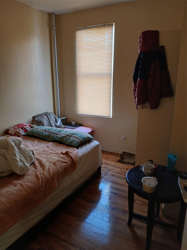 bedroom featuring wood finished floors