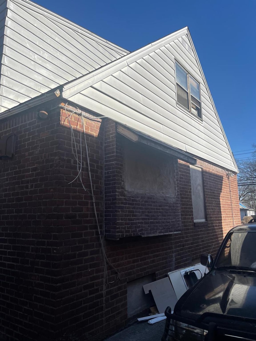 view of property exterior with brick siding