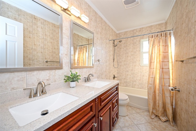 full bathroom with ornamental molding, a sink, and tile walls