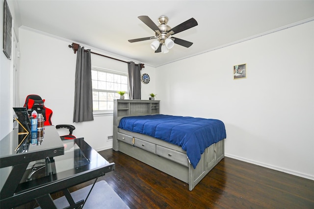 bedroom with ceiling fan, baseboards, wood finished floors, and ornamental molding