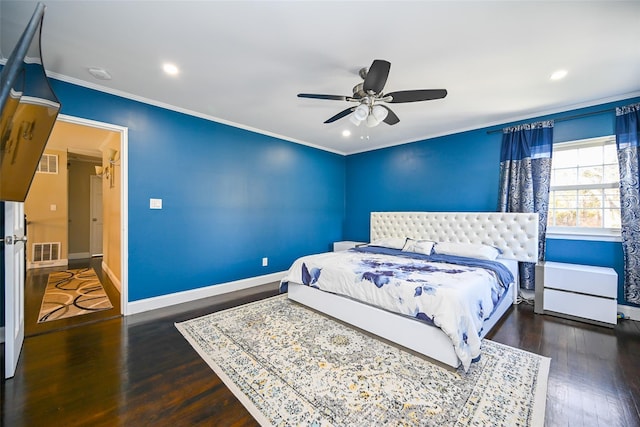 bedroom featuring ornamental molding, visible vents, baseboards, and wood finished floors