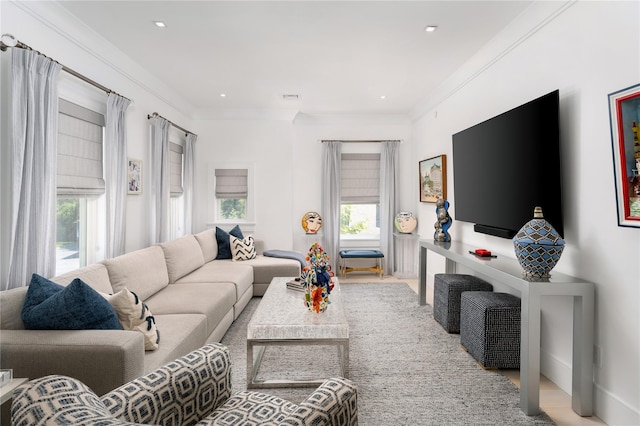 living area with visible vents, crown molding, and recessed lighting