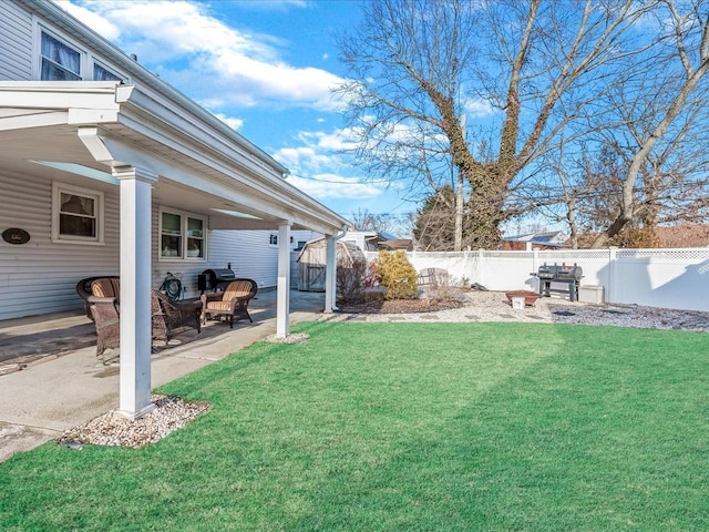 view of yard with a patio area and a fenced backyard