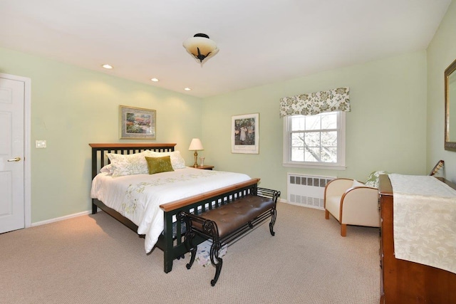 carpeted bedroom with recessed lighting, baseboards, and radiator heating unit