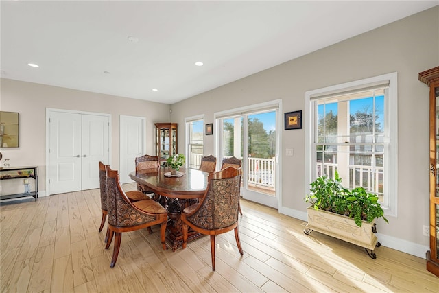 dining space featuring light wood-type flooring, baseboards, and recessed lighting