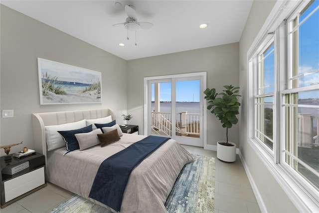 bedroom featuring access to exterior, recessed lighting, multiple windows, and baseboards