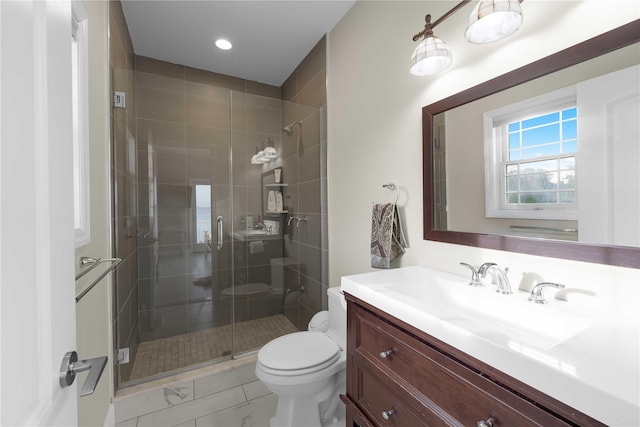 bathroom featuring toilet, a shower stall, recessed lighting, and vanity