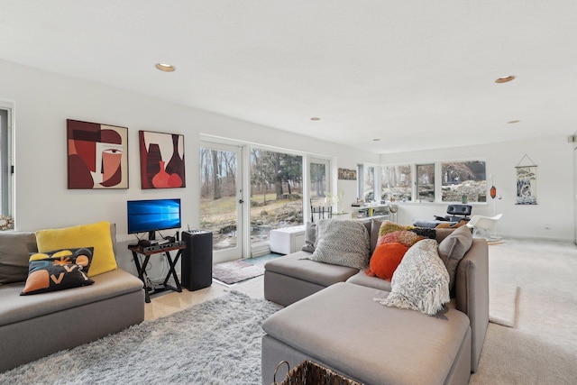 living room featuring recessed lighting and light carpet