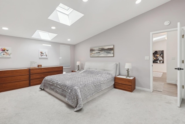 bedroom featuring recessed lighting, baseboards, lofted ceiling with skylight, and carpet floors