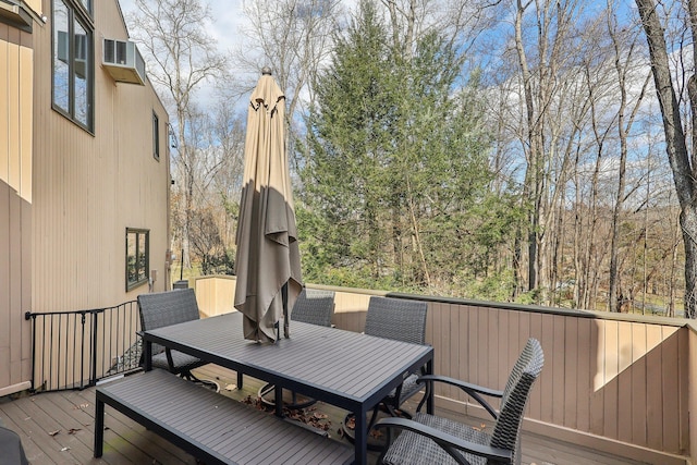 wooden terrace with outdoor dining space