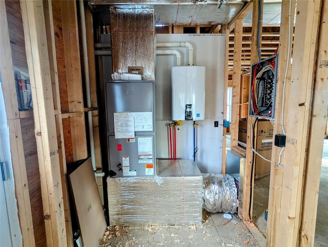 utility room featuring water heater