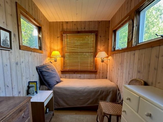 103 Greene Walk, Cherry Grove, NY 11782 - bedroom featuring multiple windows and wooden walls