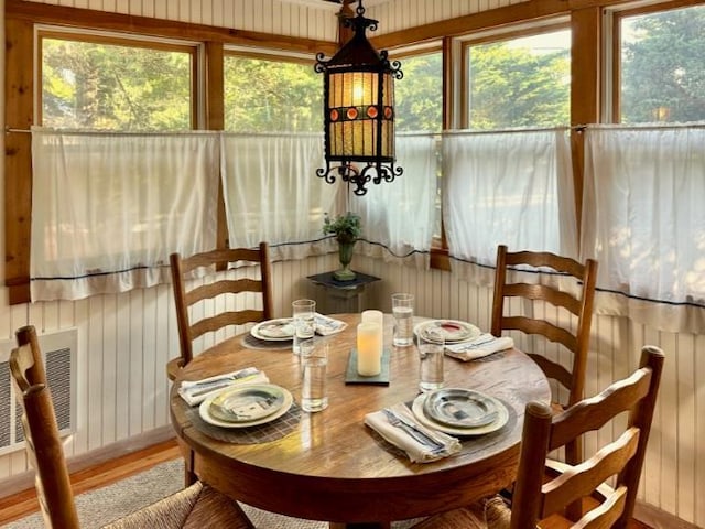 103 Greene Walk, Cherry Grove, NY 11782 - dining area with wood finished floors and wooden walls