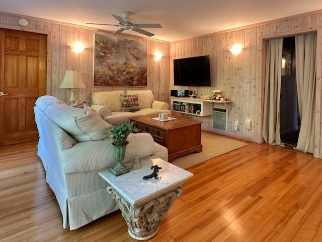 103 Greene Walk, Cherry Grove, NY 11782 - living area featuring a ceiling fan, wooden walls, and wood finished floors