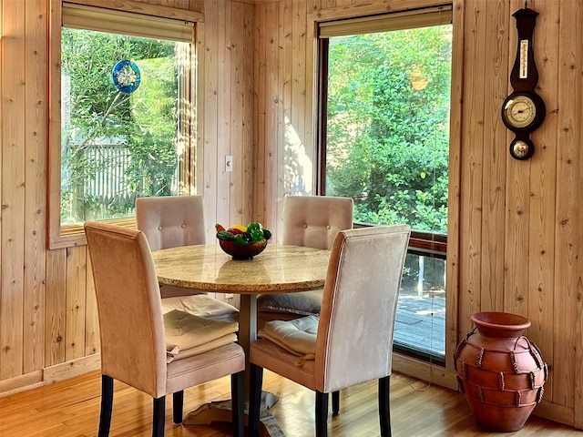 103 Greene Walk, Cherry Grove, NY 11782 - dining space featuring wooden walls, wood finished floors, healthy amount of natural light, and baseboards