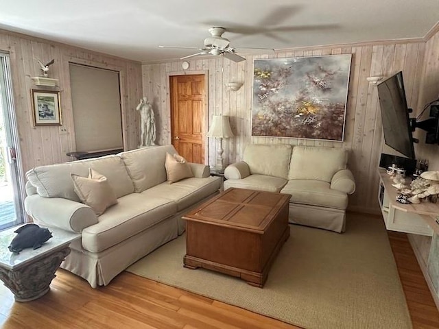 103 Greene Walk, Cherry Grove, NY 11782 - living room featuring wood walls, wood finished floors, and ceiling fan