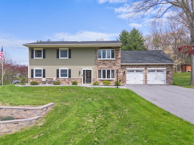 view of front of house featuring a garage, a front lawn, driveway, and stone siding