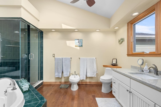 full bath featuring ceiling fan, a bathtub, a stall shower, wood finished floors, and toilet